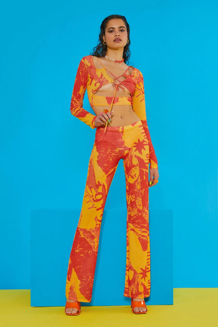 Jaded London Orange Tonal Ripped Magazine Print Mesh Trousers 1 Jaded London Orange Tonal Ripped Magazine Print Mesh Trousers