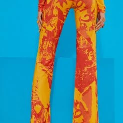 Jaded London Orange Tonal Ripped Magazine Print Mesh Trousers 7 Jaded London Orange Tonal Ripped Magazine Print Mesh Trousers